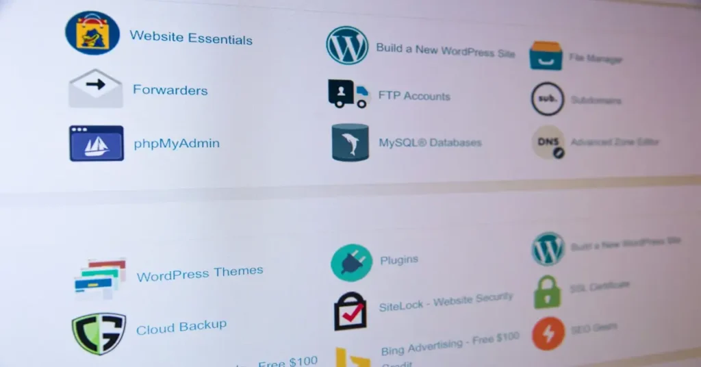 A computer screen displays a user interface for web hosting management. Icons represent various tools like WordPress, phpMyAdmin, file manager, and security features. Easily explore categories such as website essentials and email to find the best WordPress themes for your site management needs.